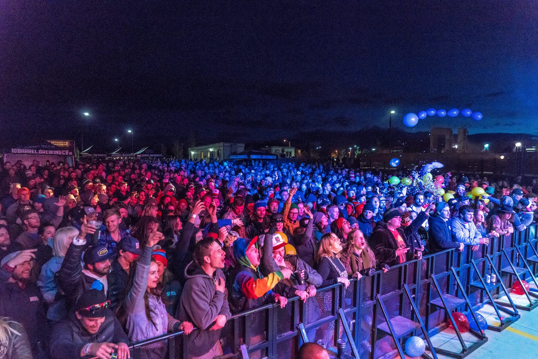 people standing in front of stage